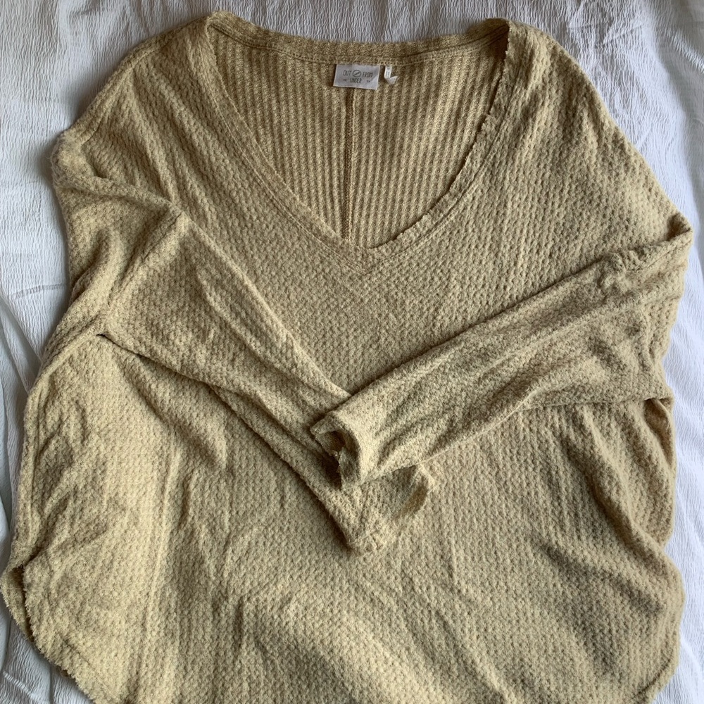 Out from under sweater